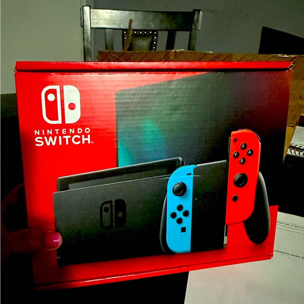 Brand new Nintendo Switch with 2 controllers & chargers.